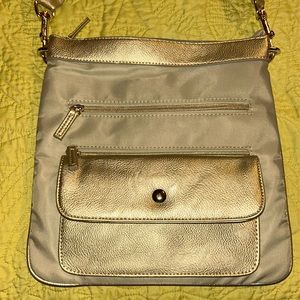 I have this chicos gold purse it had lots of room inside of the purse.